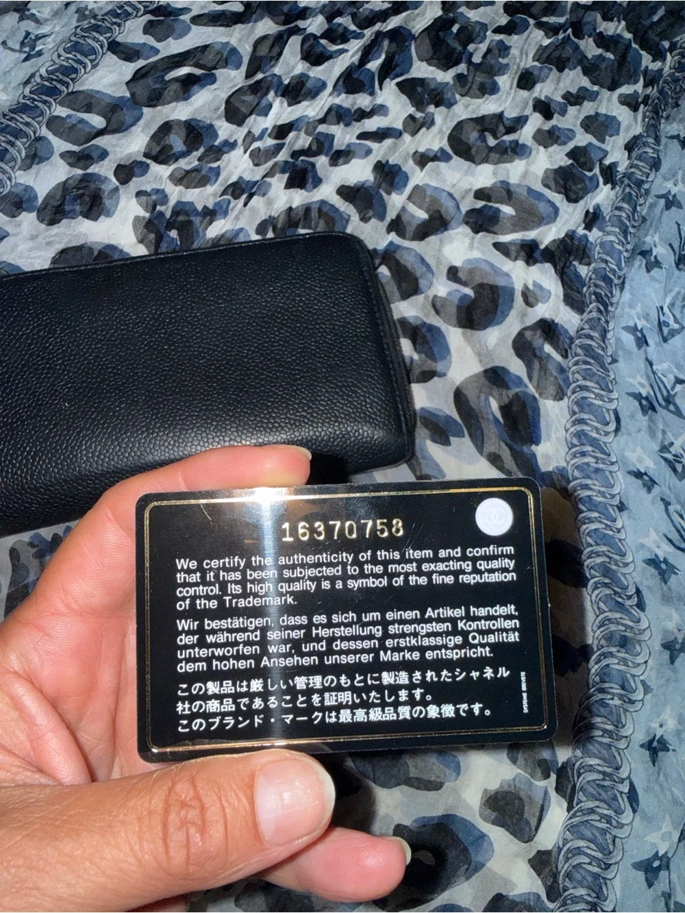 Authentic CHANEL Black Caviar Leather Zip-Around Wallet with Embossed CC